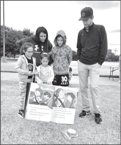 READING NIGHT- Capitol Elementary hosted their Parent Reading Night they were able to read three awesome books on an out door book walk. There was a great turn out and it was good idea. In photo in no particular order Brieana, Trevor, Ian, Gracelyn and Emmalyn Tucek (photo submitted by Cristal Isaacks)