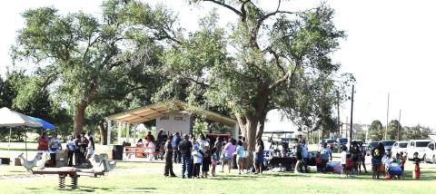 COMMUNITY INVOLVEMENT - Residents lined up for the annual community meal this past weekend at the 37th Juneteenth celebration. (Staff photo)
