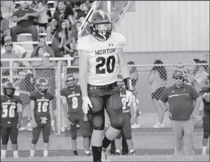 REGROUP - Morton athlete Cade Lyon went to the huddle after making the tackle on a Crosbyton Chief in their win last Friday as the away team. (Staff photo by Aalijah Soliz)