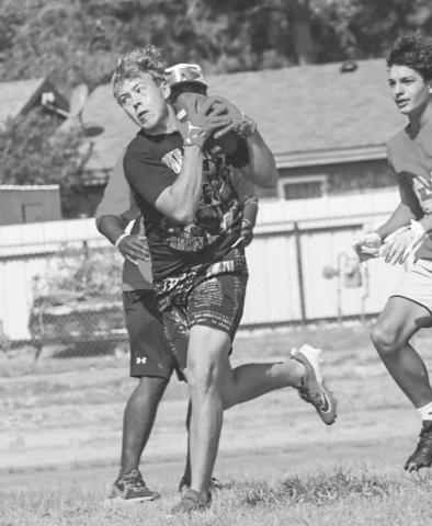 HEATING UP - Levelland Lobo Kaden Brogden caught the ball against the defense this past Thursday at the Levelland High School during summer workouts. (Staff photo by Aalijah Soliz)