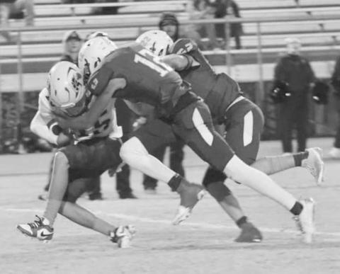 DOWN YOU GO - The Whiteface Antelope defense made short work of the Wellman-Union Wildcats last Friday in a 68-0 home win to start UIL District 3-1A1 high school football action. Pictured are Isaak Soliz (12) and Jaxon Hodge taking down a Wellman-Union runner. The Antelopes faced off against Meadow this past Friday. (Photo by Holly Crutcher)