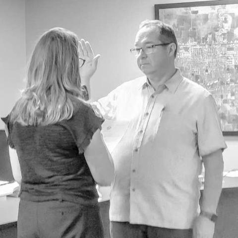 COUNCIL MEMBER DISTRICT D - Levelland City Councilman Michael Stueart underwent an Oath of Office which was administered by the City Secretary Andrea Corley during Monday evening's regular council meeting. Stueart ran in the May general election as an incumbent. (Staff photo by Dom Puente)