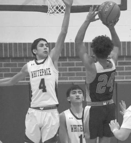GET UP - Whiteface Antelope Cesar Chavez got up with Whitharral Panther Nomar Gomez during the team’s contest last Friday night in Whiteface. (Staff photo by Aalijah Soliz)