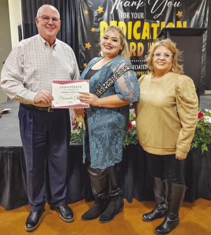 ROOKIE OFTHEYEARAWARD - The City of Levelland held its 55th annual Employee Appreciation Banquet Thursday at the Mallet Event Center and Arena. During the awards portion of the event, Diana Romo presented the Rookie of the Year Award which was presented to Sam Gomez. The Rookie of the Year Award is a new addition to the banquet’s award selection and will be continued moving forward. Pictured is City Manager James Fisher alongside Gomez and Romo. (Staff photo by Dom Puente)