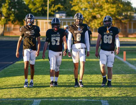 PREGAME COIN TOSS - Morton football senior team captains walk out towards the pregame coin toss before their game against Ralls this past Friday night at Indian Stadium. Pictured from left to right is EJ Rivas, Adrian Luevano, Jaeden Alvarado and Britton Boggs. They would help lead Morton to a 33-6 victory, earning their first win of the season. (Staff photo by Jentezen Smith)