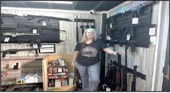 GUNS UP - Kori McNeal is welcoming new and veteran gun enthusiasts to come through her doors and check out her wide range of fire arms. (Staff photo by Hannah Woodrum)