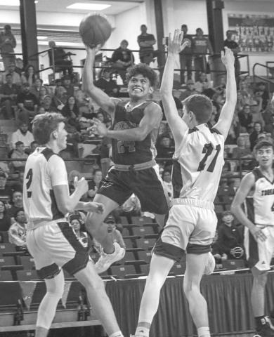 HIGH RISER - Whitharral Panther Nomar Gomez rose over the defense during the team’s last game against the Texline Tornadoes last Friday at South Plains College. (Staff photo by Aalijah Soliz)