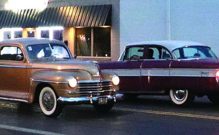 CRUISINGDOWNTHESTREET - Car enthusiasts spent Friday evening cruising down Houston Street and around downtown in Levelland. Spectators gathered in parking lots and open spaces along the roads to watch different types of cars and trucks on display. (Staff Photo by Shawn Fanklin)