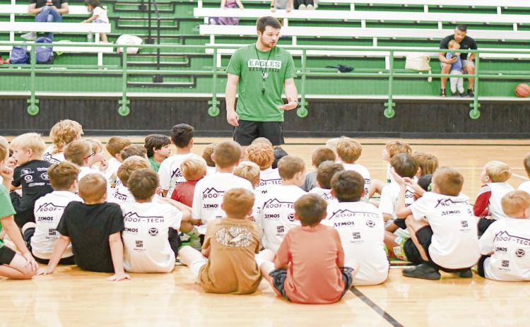 NEXT GENERATION OF EAGLES - Ropes Head Boys Basketball Coach Cameron Copley coaches up his basketball campers during their Tuesday morning session at the Ropes High School gym. The morning session was for second through fifth graders. (Staff photo by Jentezen Smith)