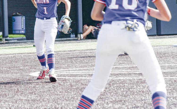 ROUTINE PLAY - Sundown Roughette Breigh Gregory makes a routine out, fielding the ball and throwing it to first baseman Araceli Ibarra during the State Semifinals at Abilene Christian University recently. (Staff photo by Jentezen Smith)